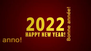 Bir kelime bulutunun kırmızı arkaplanda ve farklı dillerde mutlu bir yeni yıl mesajı içeren video animasyonu 2022 yılını temsil ediyor.