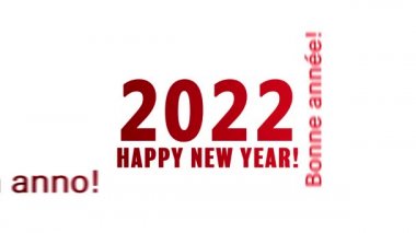Beyaz arka plan ve farklı dillerde kırmızı ile yeni yıl mesajını taşıyan bir kelime bulutunun video animasyonu 2022 yılını temsil ediyor.