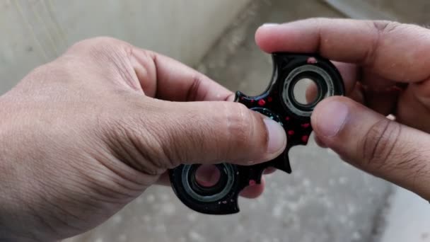 Footage Black Fidget Spinner Shape Bat Shot Blur Background Summers — Stock Video