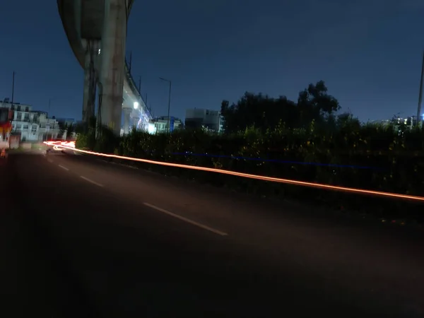 Image of light streaks of vehicles shot at night. Long exposure photos