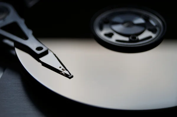 Shadowed close-up of a dismounted hard disk. — Stock Photo, Image