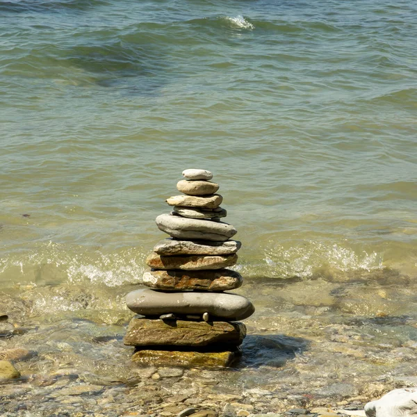 Large Tower Flat Stones Sand Pebbles Background Sea Concept Tourism Imagem De Stock