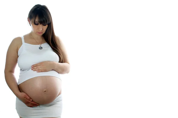 Young pregnant woman isolated over wite background — Stock Photo, Image