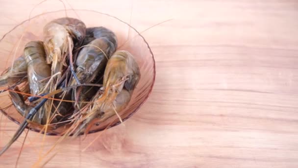 Close up of king prawn on plate on table. — Stock Video