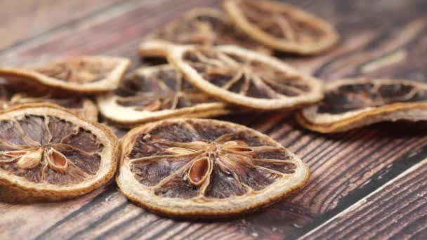 Close up of dry lemon in a bow on table — Stock Video