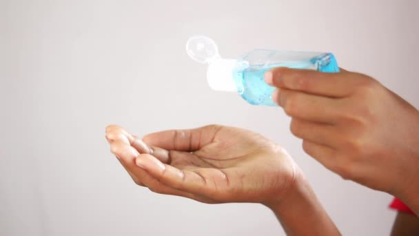 Child hand using sanitizer gel for preventing virus with copy space — Stock Video