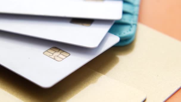 Close up of credit cards on wooden background — Stock Video