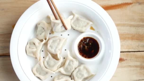 Close up of steam dim sum in a bowl — стоковое видео