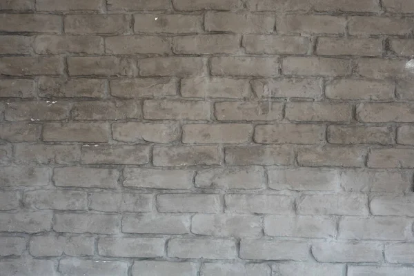 세 부점들을 보여 주는 회색 벽돌 벽 — 스톡 사진