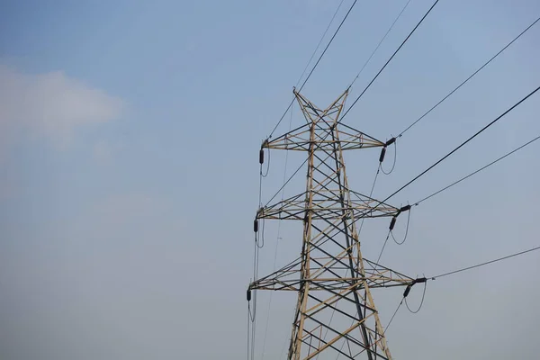 Electric lines against blue sky with copy space Stock Photo