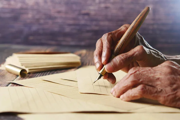 Senior women hand writing letter with a fountain pen — Stockfoto