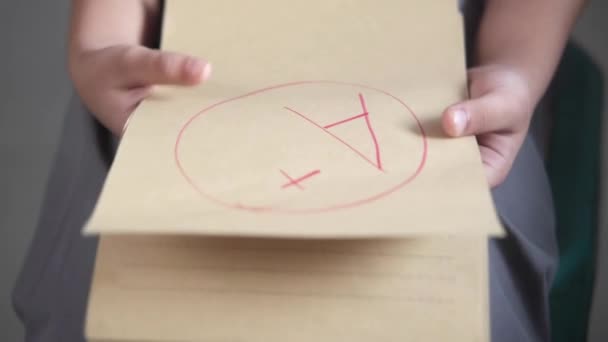 Hand holding paper with Hand drawn grade with plus in circle — Stock Video