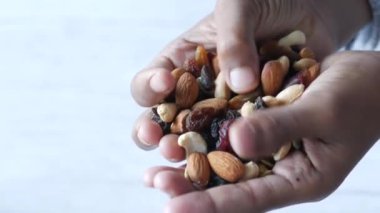 close up of mixed nut on hand with copy space 