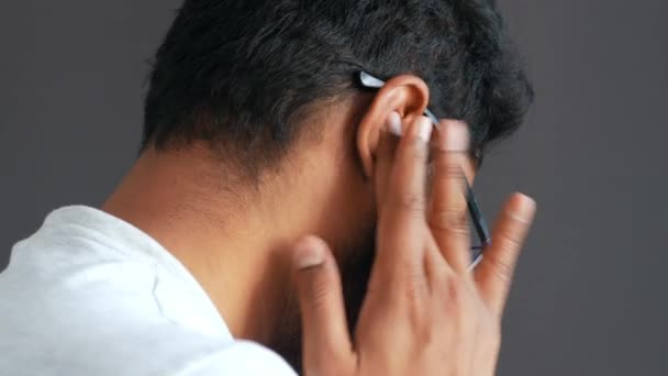 Young man having ear pain touching his painful ear , — Stock Video