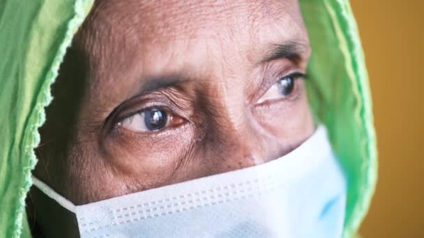 Portrait of an old indian woman wearing a surgical mask — Stock Video