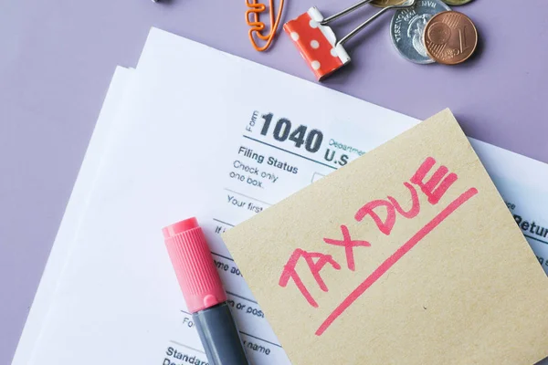 Tax return form and hand written tax due on table — Stock Photo, Image