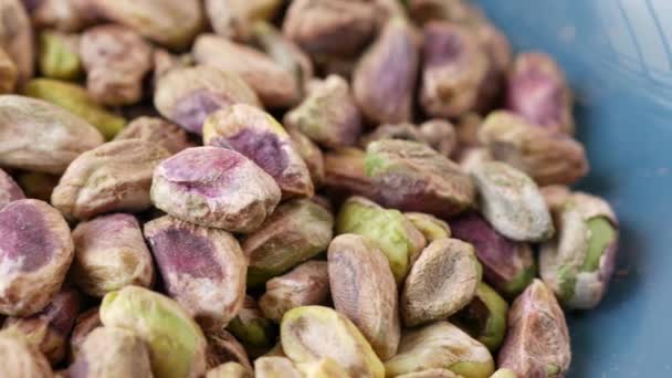 Detail shot of pistachios nut on in bowl — Stock Video