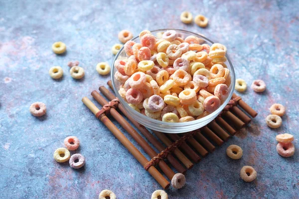 Close up of colorful cereal corn flakes in a bowl — Stock Photo, Image