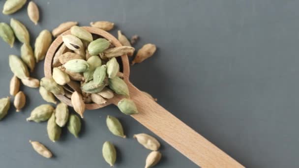 Close up of Cardamom on a spoon on table — Stock Video