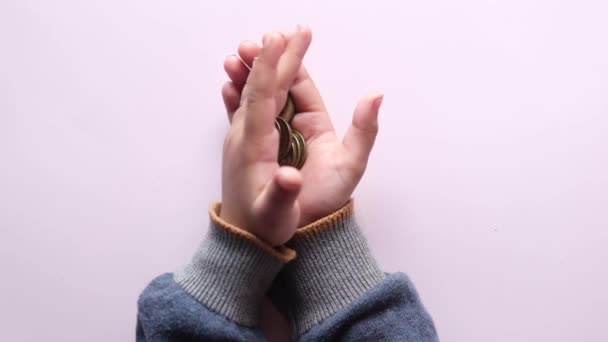 Child girl pile coin for saving. sitting on floor — Video Stock