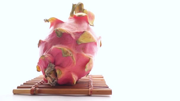 Slice of dragon fruit on a chopping board. — Stock Video