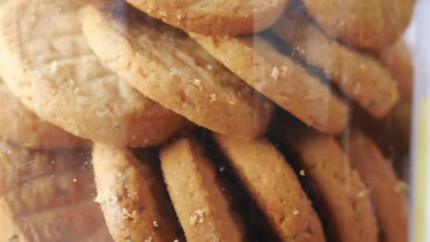 Close up of sweet cookies in a plastic container — Video Stock
