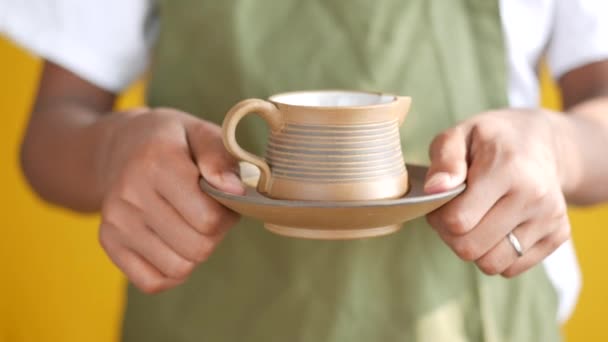 Young men serving cup of tea — Stock Video