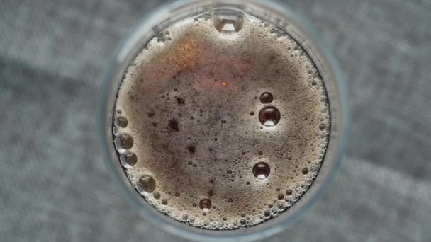 Slow motion of soft drinks with bubble top view — Video