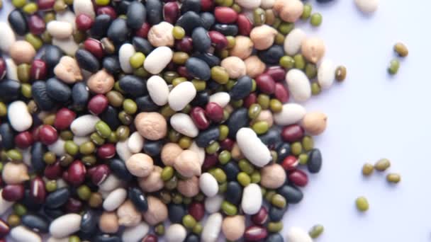 Top view of mixed beans on white background — Vídeos de Stock