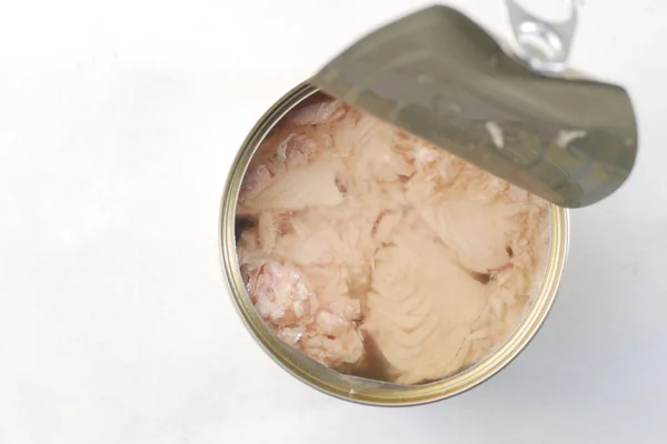 Canned tuna on wooden on white background — стоковое фото