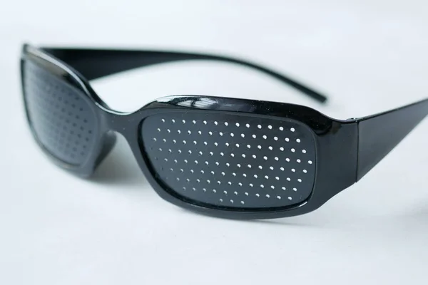 Perforation glasses with holes for training vision — Stock Photo, Image