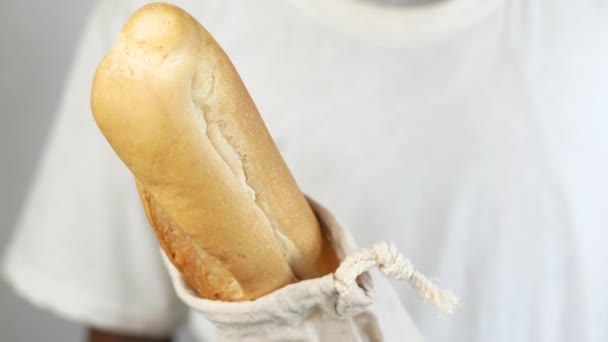 Holding a bag with bread close up — Wideo stockowe
