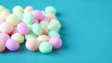 colorful Naphthalene ball on light green background .