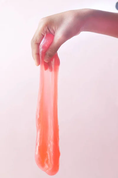 Child Hand holding pink color slime — Stock Photo, Image