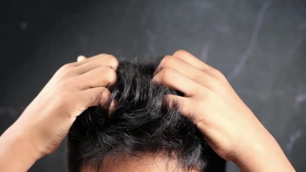 Teenage Boy Scratching Head Black Background — Stock Video