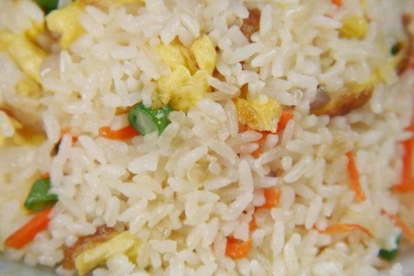 cooked rice in a bowl on table, close up