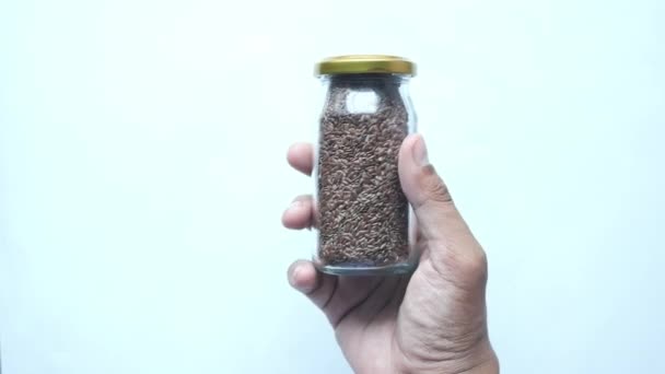 Close Flax Seeds Glass Jar — Stock Video