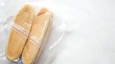 top view of baked bread in a plastic packet on table ,