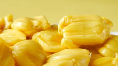  close up of hand pick slice of jackfruits in a bowl ,