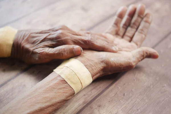 Senior Hands Gauze Bandage Wrapped — Stock Photo, Image