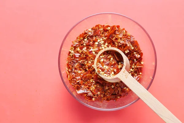 Red Chili Pepper Flakes Red Background — Foto de Stock