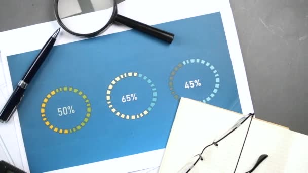 Top View Financial Charts Magnifying Glass Table — Video Stock