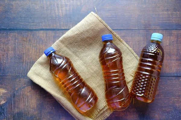 Mustard oil in a plastic jar on table . High quality 4k footage