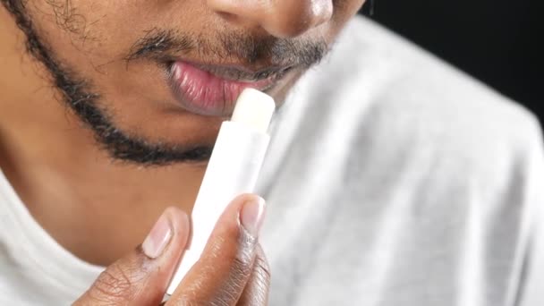 Young Man Applying Moisturising Lip Balm Lips — Stock Video