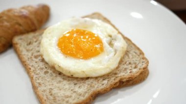poached egg on a a bread on a plate.