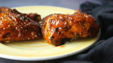 close up of slice of a BBQ chicken on plate ,