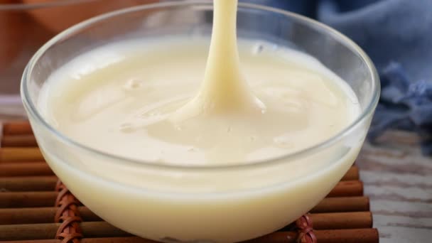 Picking Condensed Milk Spoon Bowl Close — Vídeo de Stock