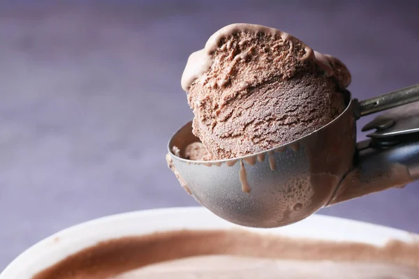 chocolate ice cream scoop isolated on black background.