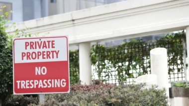 Private Property No trespassing text and buildings ,