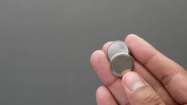 Lithium batteries on hand close up ,